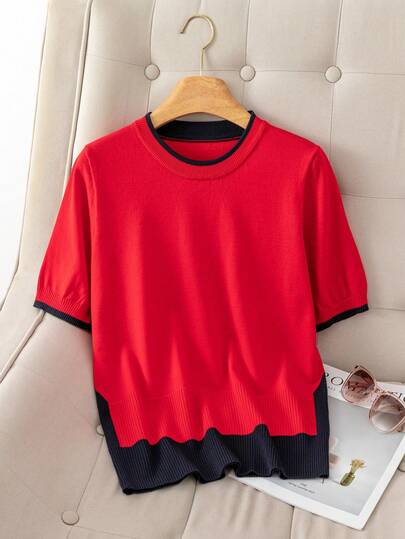 Red Short Sleeve Knit Sweater - The Main Body Is In Vibrant Red, With Black Knit Fabric Accents At The Collar, Cuffs And Hem, Creating A Color-Blocking Effect. The Hemline Features A Wavy Cut For Added Visual Interest. The Loose Fit Design And Knit Fabric Texture Provide Good Breathability.