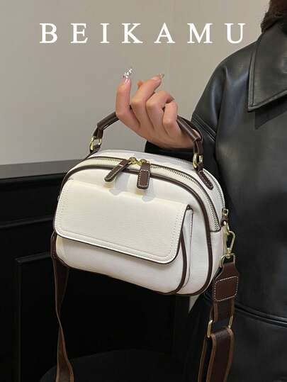 时尚撞色多口袋手提包，拉链封口托特包，配有可调节肩带，适合大学、通勤、购物、日常休闲使用。