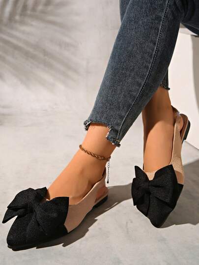 女士黑色撞色尖头套脚鞋，配优雅蝴蝶结和踝带，舒适百搭经典乐福鞋