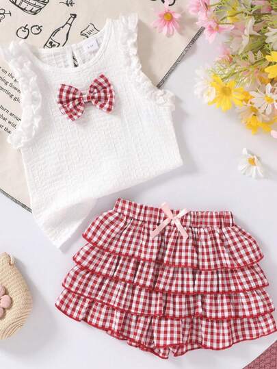 2pcs/Set Girls Soft & Comfortable Casual Fashion Cute Bow Decor Knitted Plaid T-Shirt Vest Paired With Fluffy Layered Ruffle Hem Shorts, Girls Outfit, Suitable For Summer Daily Wear, Vacation, Party And Outdoor Activities