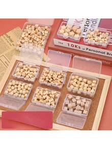 一套木制图钉，包括方头图钉、角头图钉、圆头图钉等，用于固定照片、明信片。