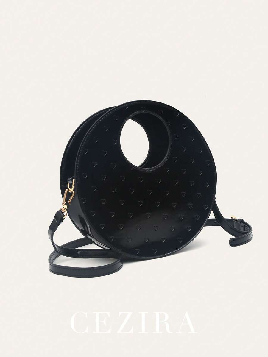 CEZIRA Elegant Lacquered PU Vegan Leather Fashion Unique Round Handbag, Heart-Shaped Embossed Magnetic Snap, Adjustable Shoulder Strap, Crossbody Bag, Suitable For Commuting, Business, Daily Use, And Outings - Black - View 1