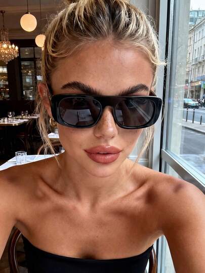 一副男女通用复古长方形塑料太阳镜，经典款式，适合户外、旅行、海滩、休闲佩戴和驾驶。