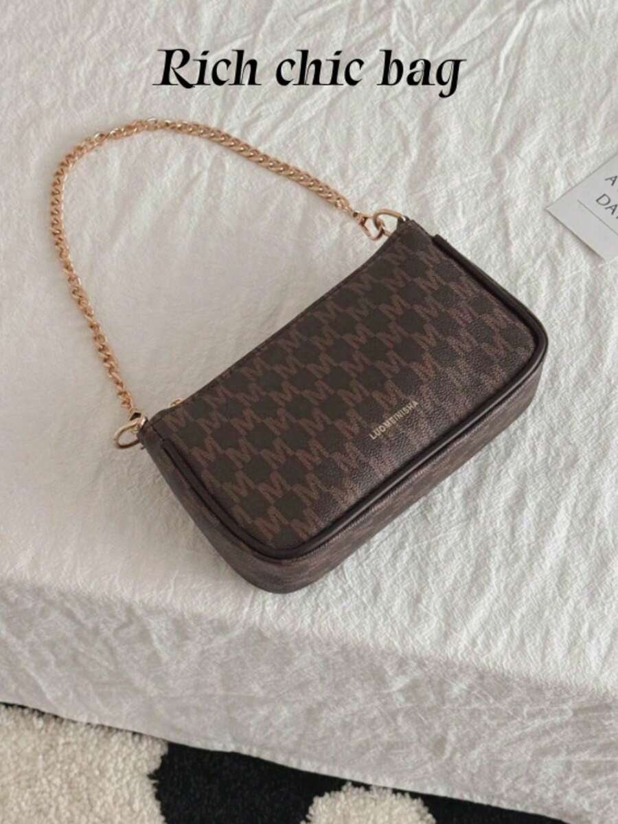 In 2024, The New Fashion Classic Joker Pu Waterproof Fabric Letter Pattern Printing Design Metal Chain Decoration Design Baguette Bag Shoulder Bag Is Suitable For Shopping.