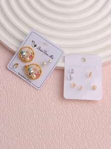 Bộ 9 khuyên tai đính ngọc trai giả tối giản thời trang hình nơ, hoa, trái tim, thích hợp cho bé gái đeo hàng ngày, có thể dùng làm trang sức, quà tặng, quà sinh nhật hoặc phụ kiện. - Bộ bông tai đính đá - Xem 8