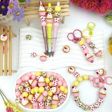 25/28颗粉色冰淇淋、蝴蝶结、爱心硅胶珠套装，搭配彩色爱心和甜甜圈图案圆珠，适合制作首饰、耳环、项链、包包、笔、手机链、化妆刷等DIY饰品，是返校季、节日、生日礼物的理想之选。