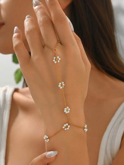 1 st lyxig elegant fingerring i rostfritt stål med blomkedja, modesmycken för kvinnor, lämplig för vardagsbruk, dekoration, fest, dejt och fotografering. Kedjan i rostfritt stål är kapad i rätt längd och antalet blompärlor är slumpmässigt.