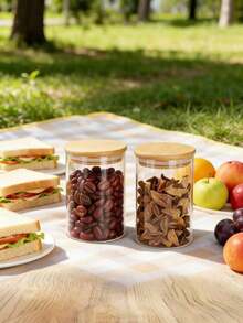 Frasco de almacenamiento hermético de vidrio borosilicato de alta calidad, adecuado para granos, cereales, frutas secas, cáscaras de cítricos secos y hojas de té. Forma de cilindro recto, emparejado con tapa de bambú, diseño transparente minimalista, adecuado para el almacenamiento doméstico. - transparente - Ver 5