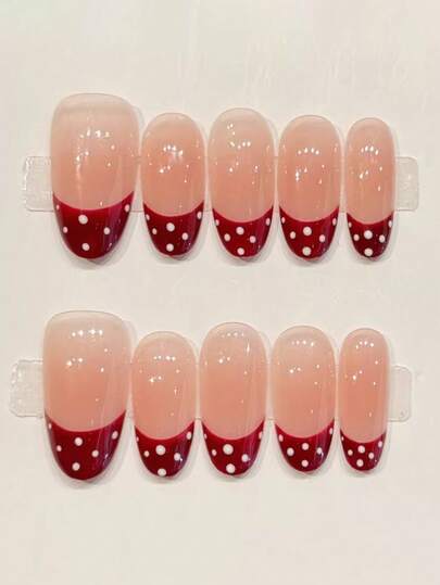 10 piezas de uñas postizas hechas a mano puras, uñas medianas con forma ovalada. Utilizando rosa nude como base, combinado con un rico estilo francés de color rojo vino y lunares blancos, es simple pero memorable, sin ser demasiado llamativo. Uñas suaves, elegantes y lindas para damas y niñas, para usar en , verano, otoño, invierno, festivales, fiestas y vida diaria. Suministros de uñas
