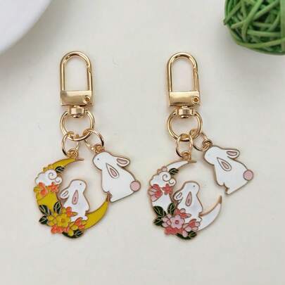 Lindo llavero de pareja con conejo de dibujos animados mirando a la luna, adorable colgante de aleación con simulación de conejo animal para decorar ropa, bolsos, regalos de fiesta festiva para amigos, versátil accesorio para teléfono