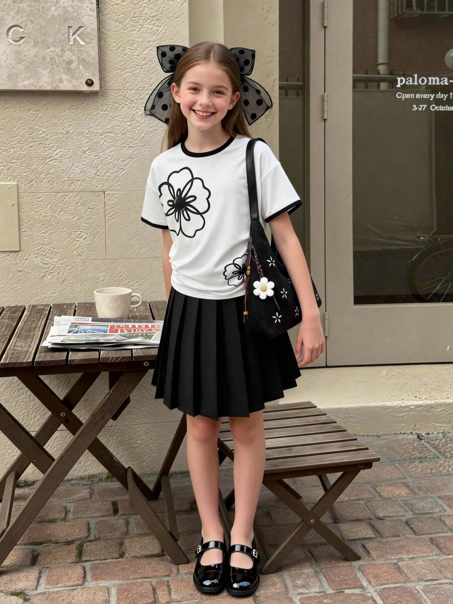 Bộ đồ mùa hè phong cách quý phái cho bé gái, áo thun trắng cổ tròn in hoa hồng phối chân váy xếp ly đen, set đồ 2 mảnh tối giản thường ngày. - màu đen - Xem 1
