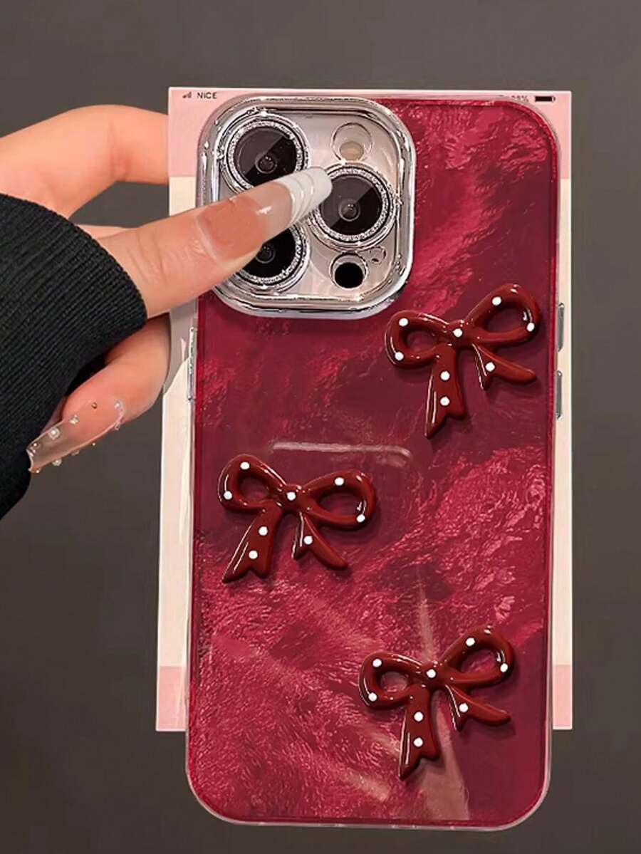 1 Pc Red Three-Dimensional Bowknot Tinfoil Grain Fine Hole Camera Following, Lovely Advanced Sense Of Fashion And Personalized From The Silicone Protective Shell, Compatible With IPhone17 Compatible With IPhone17promax/Compatible With IPhone16 Pro Max/Compatible With IPhone15 Pro/Compatible With IPhone14 Compatible With IPhone13/12/11, Suitable For Family/Friends/Sister/Girlfriend On Valentine's Day Gift/Birthday Gift/Mother's Day Gift - Burgundy - View 1