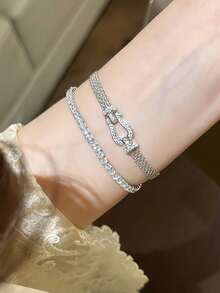 1条米兰尼西马蹄形扣编织手链，镀金镂空表带，时尚简约百搭设计