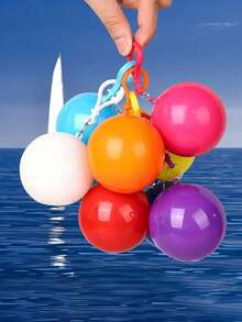 Un color seleccionado al azar. Bola portátil impermeable, un imprescindible para llevar la lluvia. Bola de compresión de chubasquero desechable y reforzado. Bola portátil de mini chubasquero, conveniente para llevar en un llavero. - Color aleatorio - Ver 12