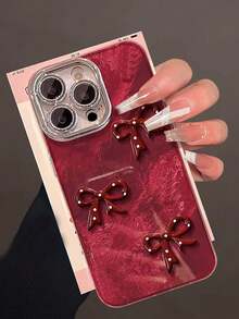 1 Pc Red Three-Dimensional Bowknot Tinfoil Grain Fine Hole Camera Following, Lovely Advanced Sense Of Fashion And Personalized From The Silicone Protective Shell, Compatible With IPhone17 Compatible With IPhone17promax/Compatible With IPhone16 Pro Max/Compatible With IPhone15 Pro/Compatible With IPhone14 Compatible With IPhone13/12/11, Suitable For Family/Friends/Sister/Girlfriend On Valentine's Day Gift/Birthday Gift/Mother's Day Gift - Burgundy - View 3