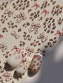 1个3D豹纹蝴蝶结美甲贴纸 迷人蝴蝶结美甲贴纸 滑动式冬季美甲装饰 美甲用品 - 彩色 - 查看 3