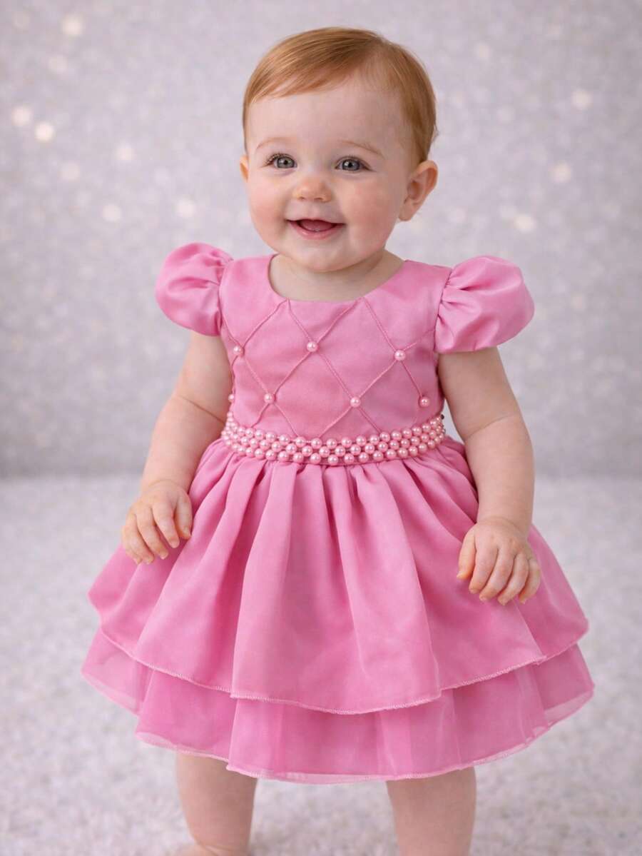 Baby Girl Party Princess Dress Puff Sleeve Appliqued Pearl Layered Skirt Tulle Light Fabric Flared Luxury Elegant Marked Waist Sash Pearls Classic Model Charming Look Sophisticated Clothing Delicate Appearance Impeccable Finish Soft Touch High Quality Shine Comfortable Baby Clothing Ideal For Baptism Birthday Wedding Christmas New Year Ceremony Special Gift Photo Shoot Baby Princess Look Timeless Piece Style Feminine Look Easy To Wear Careful Sewing Secure Closure Beautiful Modern Glamorous Children's Clothing Festive Look Stylish Girl Refined Appearance Highlight Important Occasion Commemorative Clothing Striking Presence Complete Look Charming Baby Piece That Transmits Sweetness And Sophistication Clothing That Shines And Enchant Mothers And Guests - 淺粉色 - 查看 1