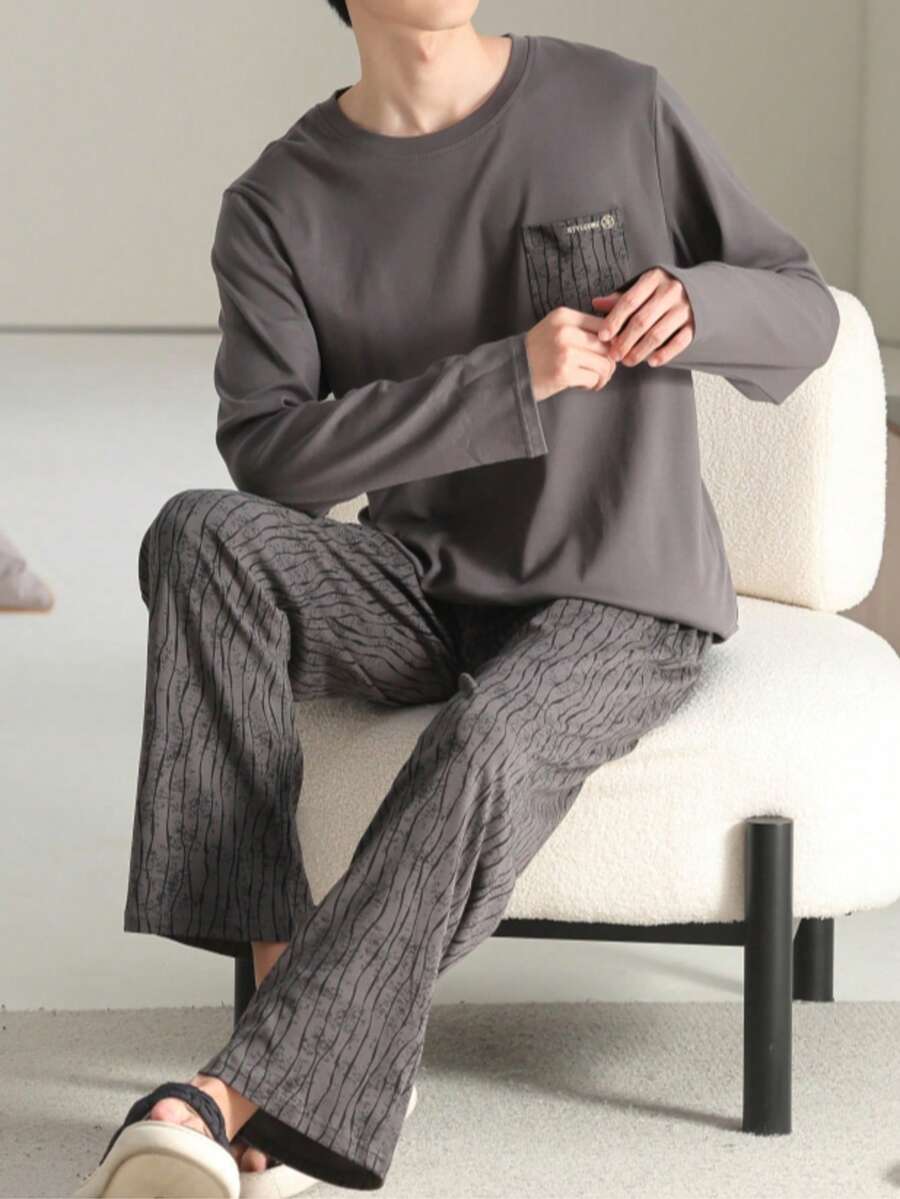 AICJ Bộ đồ ngủ nam 2 món dáng rộng rãi, thoải mái, thích hợp cho tiệc tùng, ở nhà, du lịch, giới trẻ, mùa xuân, thu, đông. Áo tay dài cổ tròn có túi, quần in họa tiết bất đối xứng, chất liệu vải dệt kim, bộ đồ mặc nhà. - Màu xám đen - Xem 1