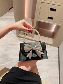 1 chiếc túi xách trang trí nơ đính đá lấp lánh sang trọng, thích hợp cho các bữa tiệc, dạ hội, sự kiện trang trọng, đám cưới. Hoàn hảo làm quà tặng Ngày Valentine cho phái nữ, phối cùng váy dạ hội, váy đính sequin và váy thanh lịch. - màu đen - Xem 2