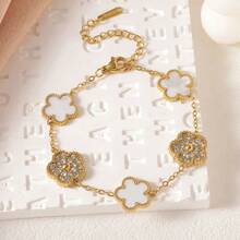 1件优雅闪亮四叶草女士手链：18K镀金高品质钛钢四叶草手镯，专为女性设计，饰有优雅花卉纹理的时尚不锈钢饰品 - 金黃色 - 查看 3