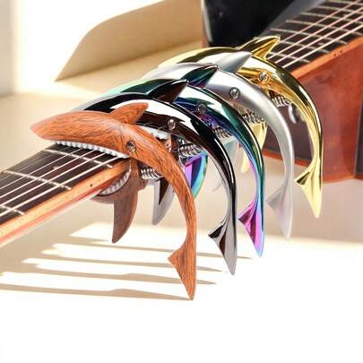 1个 - 这款时尚独特的鲨鱼造型吉他变调夹采用锌合金材质，配有硅胶垫保护琴弦，并内置高弹弹簧。适用于原声吉他和电吉他，可改变音调。