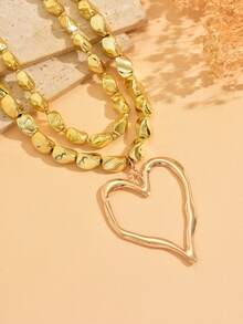 مجموعة من قلادتين مصنوعة يدويًا من سبائك معدنية ذهبية اللون بتصميم قلب مجوف مرصع بالخرز، تصميم مبالغ فيه وغير متماثل، قلادة نسائية فاخرة خفيفة الوزن مناسبة للارتداء اليومي والعطلات والحفلات - الذهبي - مشاهدة 3