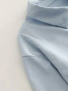 Minimalistyczny damski luźny sweter z klapami i długim rękawem, z kołnierzykiem koszulowym i asymetrycznym dołem