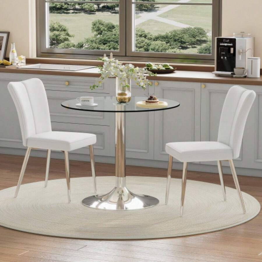 Zestaw Esstisch: Nowoczesny minimalistyczny Esstisch aus Sicherheitsglas mit 85 cm Durchmesser, kombiniert mit 2 białe PU-Esszimmerstühlen mit silberfarbenen Stützbeinen. Geeignet für Esszimmer, Küche. - Biały - Zobacz 1