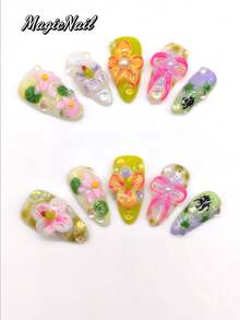 10片纯手工压制美甲贴片，25mm长杏仁形，米色底，青柠渐变水润底，立体凸起花朵，凸起蝴蝶结细绳粉色，手绘黑色细菌卡通图案，凸起圆点装饰。可爱美甲贴片，适合日常休闲度假，也可用于宴会、派对、演出等场合。美甲用品 - 彩色 - 查看 2