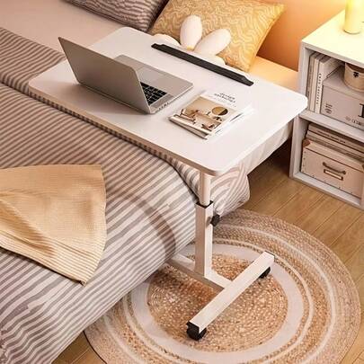 This Movable Storage Table Features Four Wheels, Adjustable Height And Swivel, And A Modern White/Black/Grey Color Scheme. It's Space-Saving And Suitable For Home, Travel, Outdoor Use, And Elder Care – Height Adjustable, Swivel, Metal Frame, And Wooden Surface. Ideal For Laptops, Books, And Meals.
