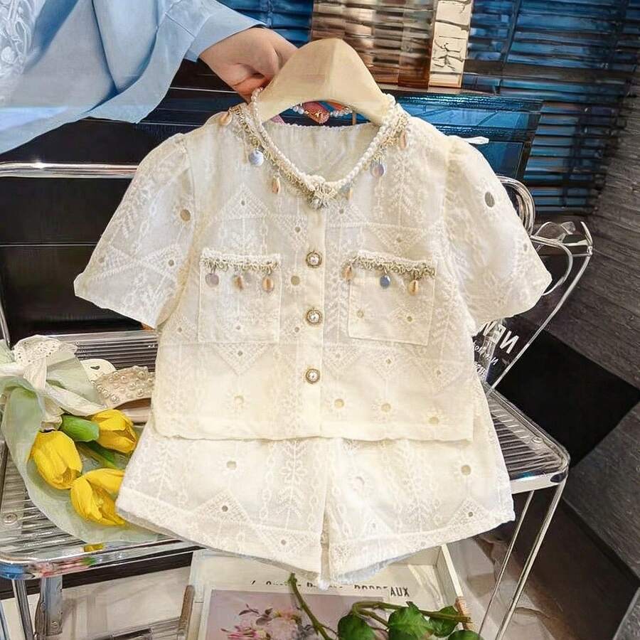 Bộ áo và quần short thêu họa tiết, tay áo cánh hoa, cài cúc đơn, có túi, dành cho bé gái. - Màu be - Xem 1