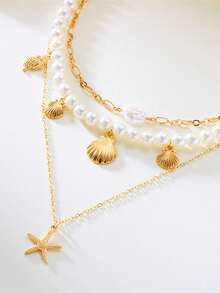 女士三件套珍珠、海星和贝壳叠层项链，优雅精致，适合休闲佩戴和夏季海滩装扮