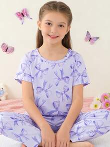 2 pezzi Set pigiama per ragazze pre-adolescenti, motivo a fiocco carino, top a maniche corte con scollo tondo viola e pantaloni, in tessuto a maglia ignifugo, può essere indossato come abbigliamento da relax, adatto per tutte le stagioni, primavera/estate per ragazze - Lilla Viola - Visualizzare 4