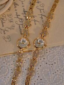 Nouvelle montre pour femme en forme de papillon, plaquée or et de style français, est exquise, élégante et raffinée, avec un petit côté rétro haut de gamme. Fonctionnant à quartz, elle est idéale au quotidien, pour les fêtes, les occasions spéciales ou comme cadeau d'anniversaire ou de Noël. - Doré - Voir 2