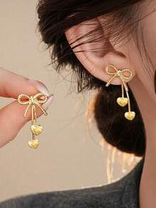 زوج من أقراط الأذن الفاخرة الفريدة ذات الفيونكة الذهبية والشرابة على شكل قلب، مناسبة للنساء، عيد الحب واللبس اليومي - الذهبي - مشاهدة 1