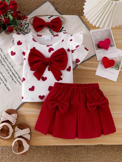 Conjunto elegante de 3 piezas para niña bebé: Blusa de cuello redondo y manga corta con estampado de corazones, falda mini plisada de unicolor con moño y diadema