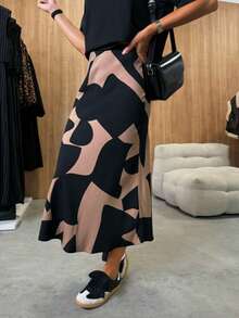 时尚不对称印花休闲梭织面料修身半身裙，适合早春日常穿着。 - 巧克力棕 - 查看 11