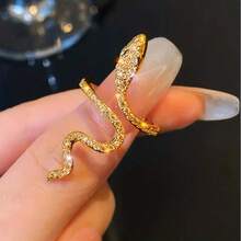 1 buah cincin berbentuk ular dengan kemasan unik, bertatahkan rhinestones berkilau, tersedia dalam warna emas atau perak, dapat dipadukan dengan smartphone Anda sehari-hari. - Seperti yang ditunjukkan - View 1