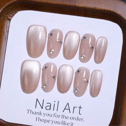 10 móng giả ngắn hình oval màu nâu, làm thủ công 100%, kiểu mắt mèo bóng mờ với đá lấp lánh trang trí, có thể tái sử dụng, phù hợp cho thiết kế móng theo mùa và sử dụng hàng ngày.