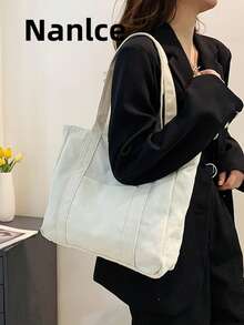 大容量帆布休闲手提包，多功能单肩包，帆布包升级版，适合青少年、女性或学生，可装书籍、购物物品，是返校必备单品，轻便可折叠，经典休闲，是青少年、女性、大学生的理想之选，非常适合开学第一天、中小学生，大学必备单品