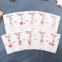 情人节礼盒套装，10件套，包含口袋拥抱卡片，是送给她/他的完美小礼物，也适合婚礼和派对。口袋拥抱卡片传递真挚的祝福。迷你可爱钥匙扣套装，包含心形、泰迪熊、蝴蝶结、酒杯、花束等多种图案，英文版。