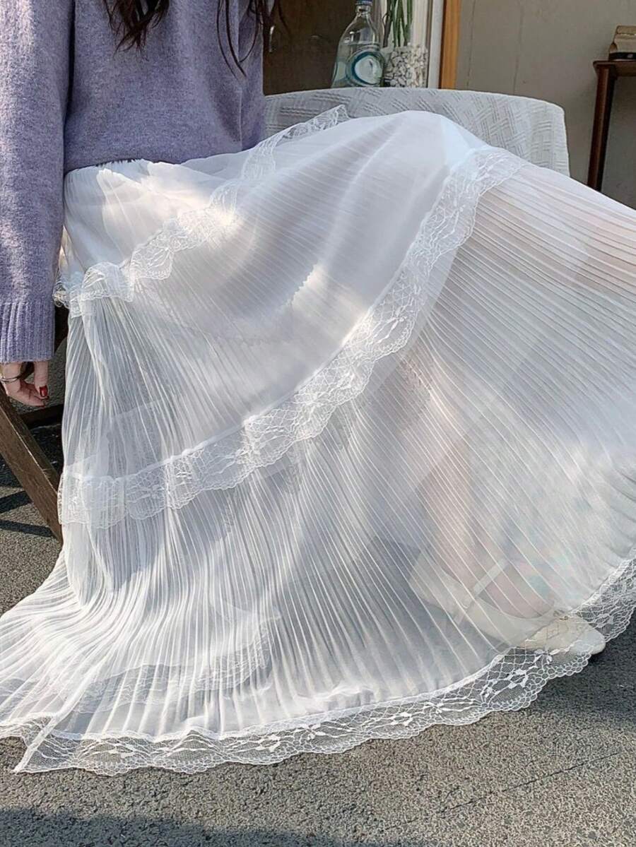 2026春夏新款女装高腰修身蕾丝网纱拼接褶裥A字裙，垂坠效果，白色