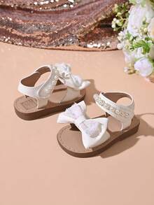 "Girls' Sparkly Bow & Pearl Sandals – Adjustable Hook And Loop Strap, Soft Padded Footbed, Glitter Accents, Stylish Summer Party Kids Footwear" - White - View 5