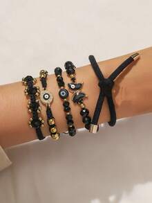 5件套时尚性感沙滩度假风手链套装，包含蝴蝶、水钻、恶魔之眼和可爱熊掌元素，适合女性休闲、日常、度假和街头穿着。 - 黑色 - 查看 2