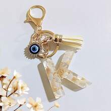 1个米色字母钥匙扣，恶魔之眼钥匙扣，流苏包饰吊坠，派对礼品 - 米色 - 查看 34