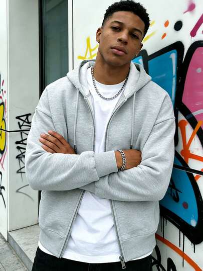 Herr enfärgad huvtröja med dragkedja och flera fickor, lämplig för utomhusbruk, vår och höst