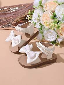 "Girls' Sparkly Bow & Pearl Sandals – Adjustable Hook And Loop Strap, Soft Padded Footbed, Glitter Accents, Stylish Summer Party Kids Footwear" - White - View 6