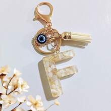 1个米色字母钥匙扣，恶魔之眼钥匙扣，流苏包饰吊坠，派对礼品 - 米色 - 查看 38