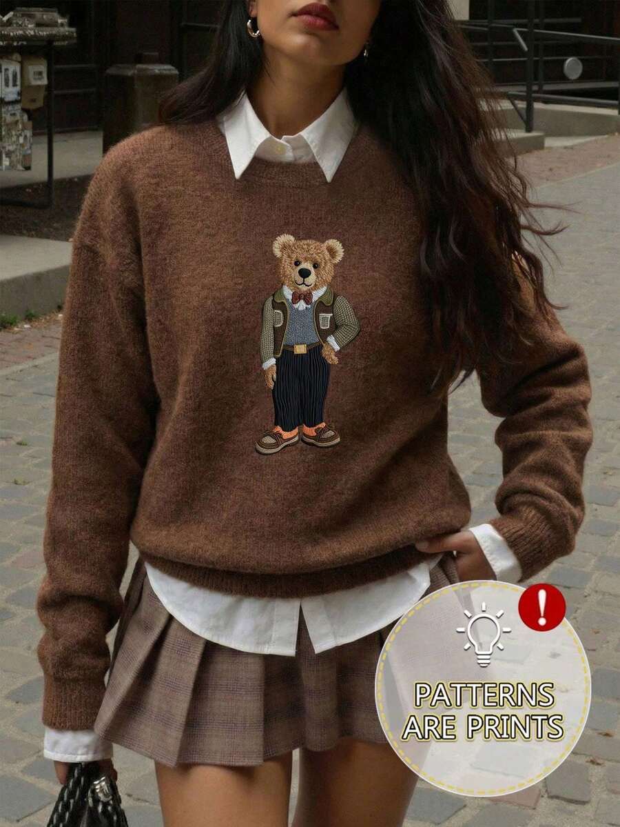 女士新款秋冬时尚毛衣，饰有复古绅士熊图案。这款宽松圆领长袖毛衣采用柔软舒适的面料制成，非常适合休闲日常穿着。属于新款秋冬系列。叠穿上衣，适合新年和情人节穿着，是情人节的完美礼物之选。 - 咖啡棕 - 查看 1