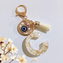 1个米色字母钥匙扣，恶魔之眼钥匙扣，流苏包饰吊坠，派对礼品 - 米色 - 查看 24